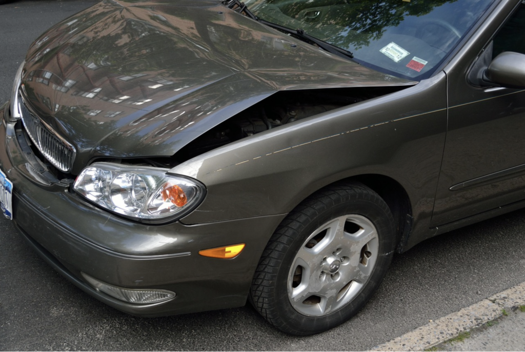 A close up of a car after a small crash