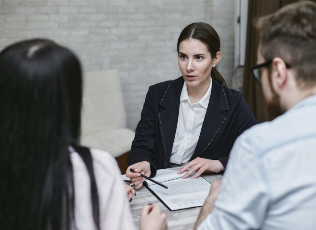 A lawyer speaking to their clients