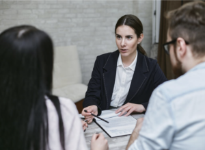 A lawyer speaking to their clients